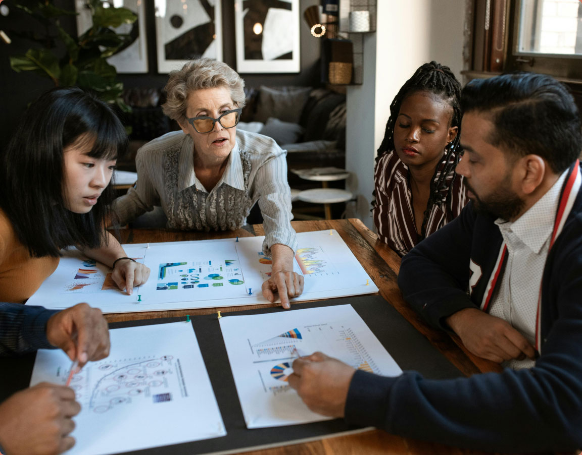 group of business people looking over landscape design plans